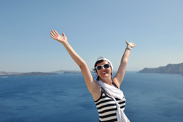 Image showing Greek woman on the streets of Oia, Santorini, Greece