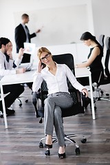 Image showing business woman with her staff in background