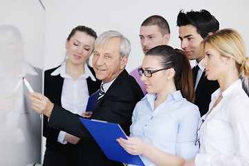 Image showing Senior business man giving a presentation