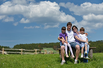 Image showing happy young family have fun outdoors