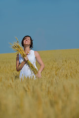 Image showing young woman in wheat field at summer