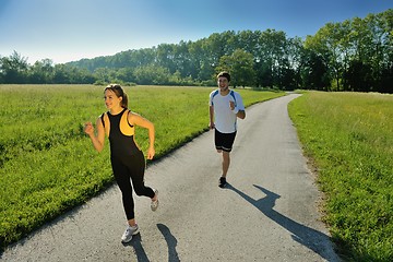 Image showing Young couple jogging