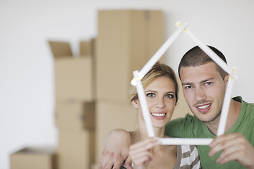 Image showing Young couple moving in new home