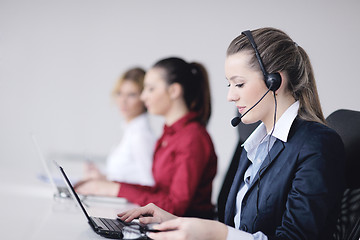 Image showing business woman group with headphones