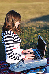 Image showing young teen girl work on laptop outdoor