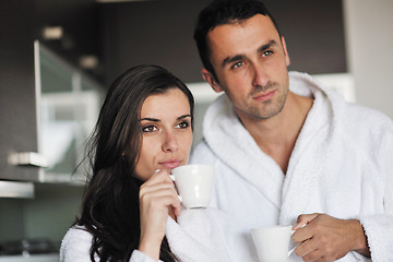 Image showing Young love couple taking fresh morning cup of coffee