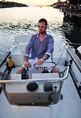 Image showing portrait of happy young man on boat