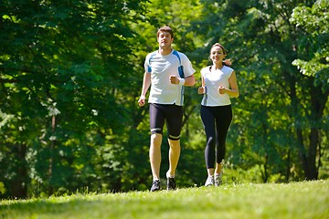 Image showing Young couple jogging