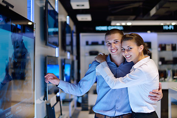 Image showing Young couple in consumer electronics store