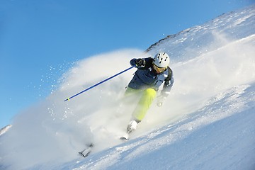 Image showing skiing on fresh snow at winter season at beautiful sunny day