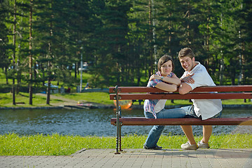 Image showing Portrait of romantic young couple smiling together outdoor