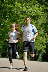 Image showing Young couple jogging