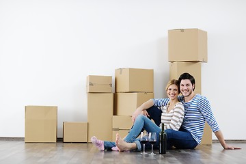 Image showing Young couple moving in new house