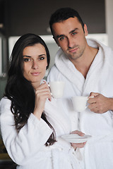 Image showing Young love couple taking fresh morning cup of coffee