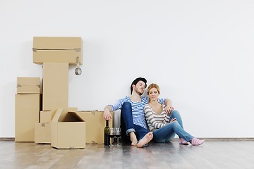 Image showing Young couple moving in new house