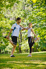 Image showing Couple doing stretching exercise  after jogging