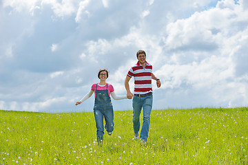 Image showing Portrait of romantic young couple smiling together outdoor