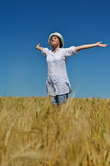 Image showing young woman in wheat field at summer