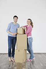 Image showing Young couple moving in new home