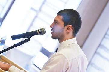 Image showing Young  business man giving a presentation on conference