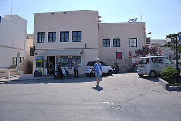 Image showing Greek woman on the streets of Oia, Santorini, Greece