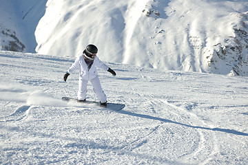 Image showing skiing on fresh snow at winter season at beautiful sunny day