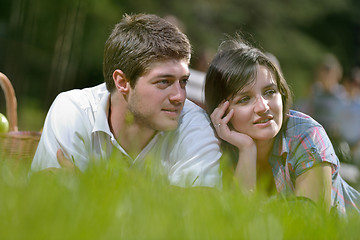 Image showing happy young couple having a picnic outdoor