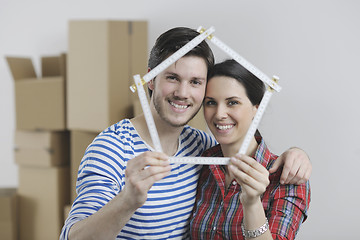 Image showing Young couple moving in new home