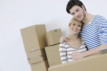 Image showing Young couple moving in new home