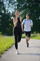 Image showing Young couple jogging at morning