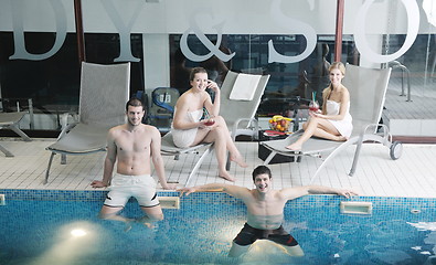 Image showing young people group at spa swimming pool