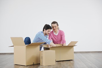 Image showing Young couple moving in new house