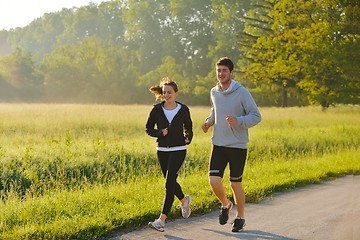 Image showing Young couple jogging