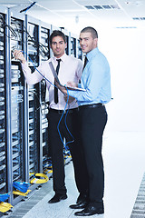 Image showing it enineers in network server room