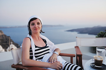 Image showing Greek woman on the streets of Oia, Santorini, Greece