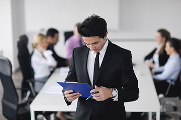 Image showing young business man at meeting