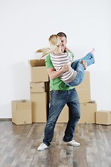 Image showing Young couple moving in new house