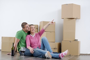 Image showing Young couple moving in new house