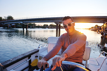 Image showing portrait of happy young man on boat