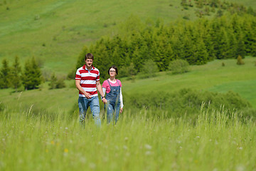 Image showing Portrait of romantic young couple smiling together outdoor