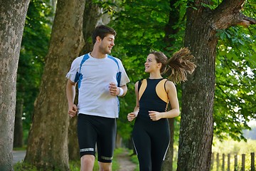 Image showing Young couple jogging at morning