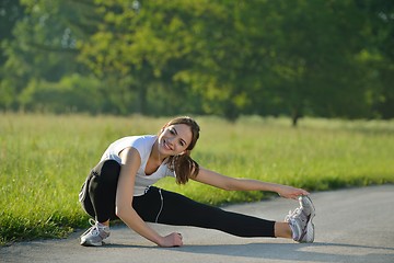 Image showing Young beautiful  woman jogging at morning in park