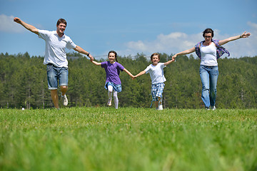 Image showing happy young family have fun outdoors