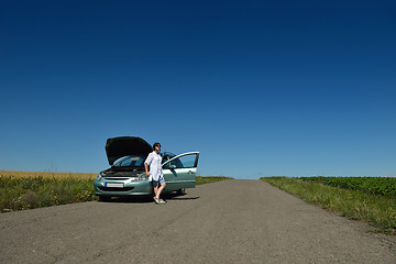 Image showing woman with broken car