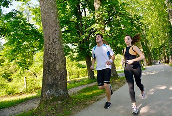 Image showing Young couple jogging