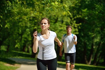 Image showing Young couple jogging at morning