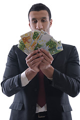 Image showing Business man holding money