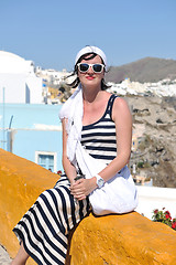 Image showing Greek woman on the streets of Oia, Santorini, Greece