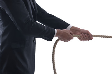 Image showing business man with rope isolated on white background