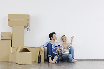 Image showing Young couple moving in new home
